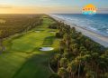Aerial sunrise view of championship golf course in Myrtle Beach showing pristine fairways, greens, and coastal backdrop - complete guide to Grand Strand golf courses