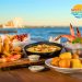 Myrtle Beach signature dishes including calabash fried shrimp, shrimp and grits, seafood boil, and hushpuppies arranged on coastal table